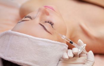 a woman during an Injectables procedure