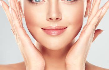 woman pointing at her face