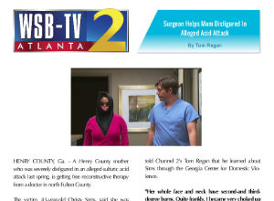 A news article screenshot shows a woman in a face covering and a man in medical scrubs walking together, with WSB-TV 2 Atlanta and headline banners visible at the top.
