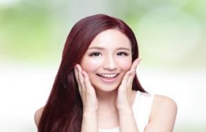 korean woman smiling after facial liposuction atlanta ga