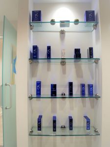 A display shelf with skincare products offered for sale at Kalos Facial Plastic Surgery, LLC in Atlanta GA.