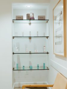 A display shelf with skincare products offered for sale at Kalos Facial Plastic Surgery, LLC in Atlanta GA.