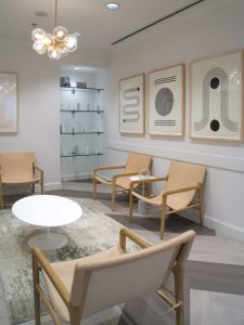 A waiting area and a display shelf with skincare products offered for sale at Kalos Facial Plastic Surgery, LLC in Atlanta GA.