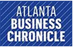 Blue logo with diagonal stripes reading "Atlanta Business Chronicle" in bold white letters.