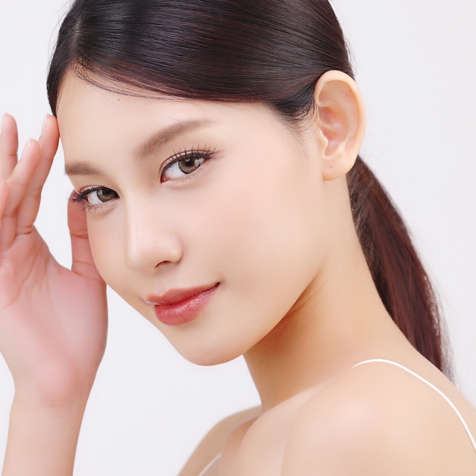 Close up facial of young Asian beautiful woman with K-beauty make up style and healthy and perfect skin isolated on white background for skincare commercial product advertising.