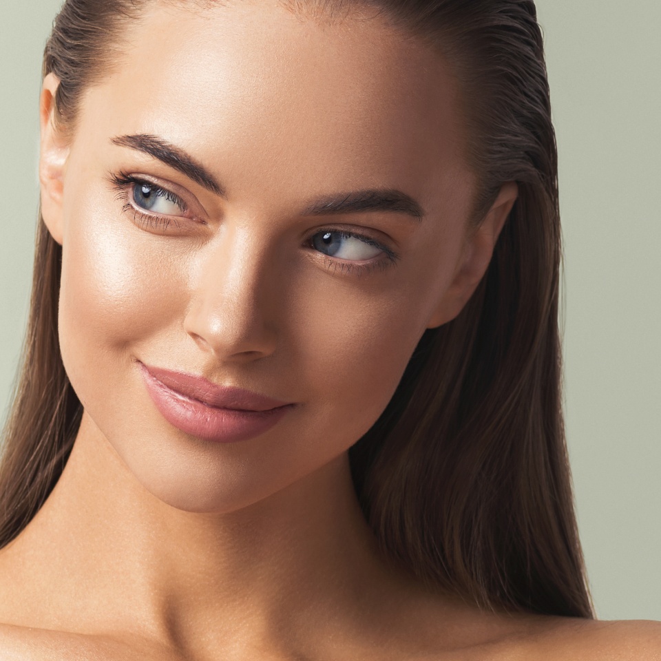 Woman face beautiul eyes nose clean tanned skin cute happy smile beauty female