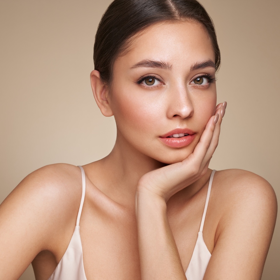 Portrait beautiful young woman with clean fresh skin. Model with healthy skin, close up portrait. Cosmetology, beauty and spa