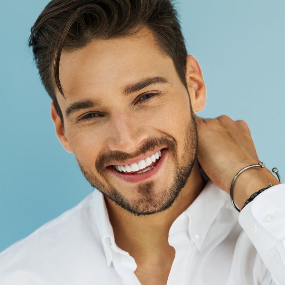 Portrait of sexy smiling male model