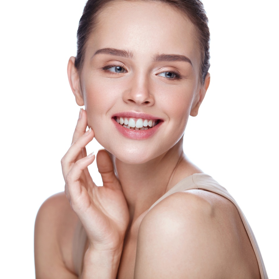 Beauty Cosmetics. Portrait Of Beautiful Smiling Woman Caressing Perfect Soft Skin. Close Up Of Attractive Young Female Model With Professional Natural Makeup. Facial Care. High Resolution