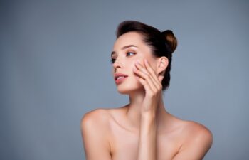 Photo of tender charming lady naked shoulders lifting effect therapy isolated on grey color background