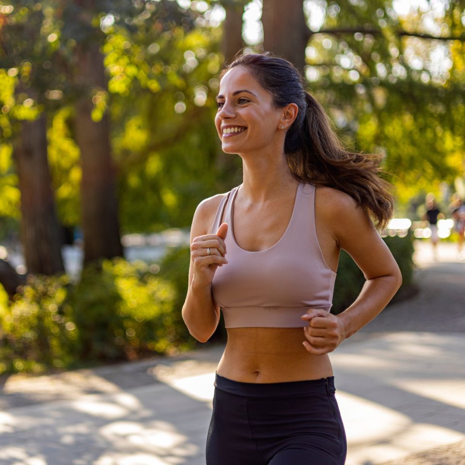 Female runner running outdoor in nature. 