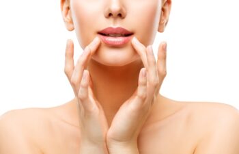 Woman Lips Care and Face Beauty Make Up, Model Touching Lip by Hands, Natural Skin Makeup, White Isolated