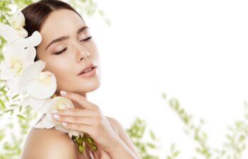 Beauty Skin Care and Face Makeup, Woman Skincare Natural Make Up, Beautiful Model and Orchid Flower, eyes closed