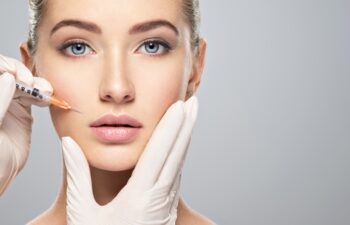 Woman getting cosmetic injection of botox near lips, closeup. Woman in beauty salon. plastic surgery clinic.