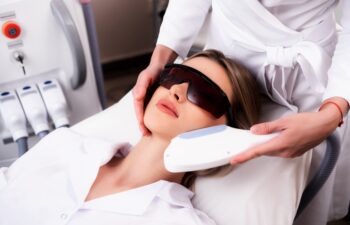 Laser hair removal on a woman's face in a beauty salon. Photo of a woman receiving a cosmetologist procedure for skin rejuvenation. The concept of aesthetic medicine. Modern technologies in medicine.
