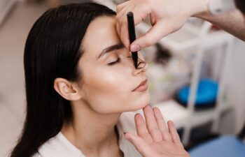 ENT doctor is drawing mark up lines on nose before rhinoplasty surgery. Rhinoplasty markup. Rhinoplasty is reshaping nose surgery for change appearance of the nose and improve breathing