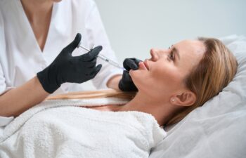 Blonde client receives a rejuvenating chin injection