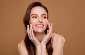 Photo of happy attractive lady touch cheeks wash face applying peeling cream on pastel color background