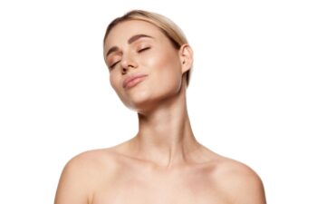 Radiant young woman with clear, perfect skin embodies the ideal of natural beauty, isolated on white studio background. Concept of beauty, plastic surgery, face lifting, face building